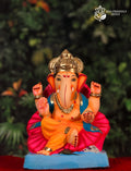 10 inch Cross Mandi Ganpati idol with Jaswanda design in yellow and blue