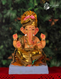 Nakshi Ganesh idol in golden drapery, 12 inches, eco-friendly Shadu Mathi clay murti with floral crown
